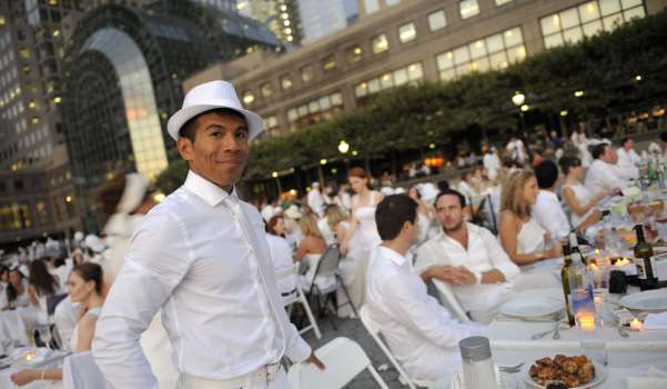 25 August 2011 - New York - Over 1000 people dressed all in white set up tables and chairs and brought baskets of food at the impromptu Diner En Blanc Pop-up French Picnic at the Winter Garden outside the World Financial Center on August 25, 2011; guest were not given the location until 1 hour before the event was to start. New York, NY. Photo Credit: Anthony Behar/Sipa Press/DEBsipatb.022/1108260510