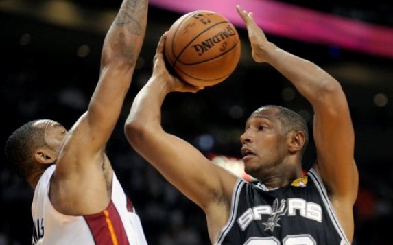 San Antonio Spurs forward Boris Diaw looks to pass the ball around Miami Heat forward Rashard Lewis during the first half in Game 3 of the NBA Finals at AmericanAirlines Arena in Miami on Tuesday, June 10, 2014. (Michael Laughlin/Sun Sentinel/MCT)
