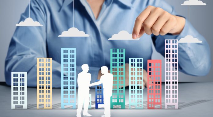 Building in hand businessmen