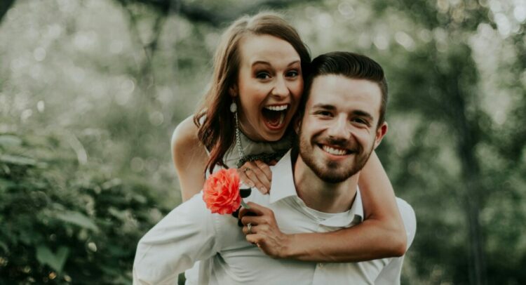 We were walking through a park with trails leading into the forests, when we saw this breathtaking coral flower… my sister ran and got it and jumped on her husbands back… right then and there is where is captured this priceless image.